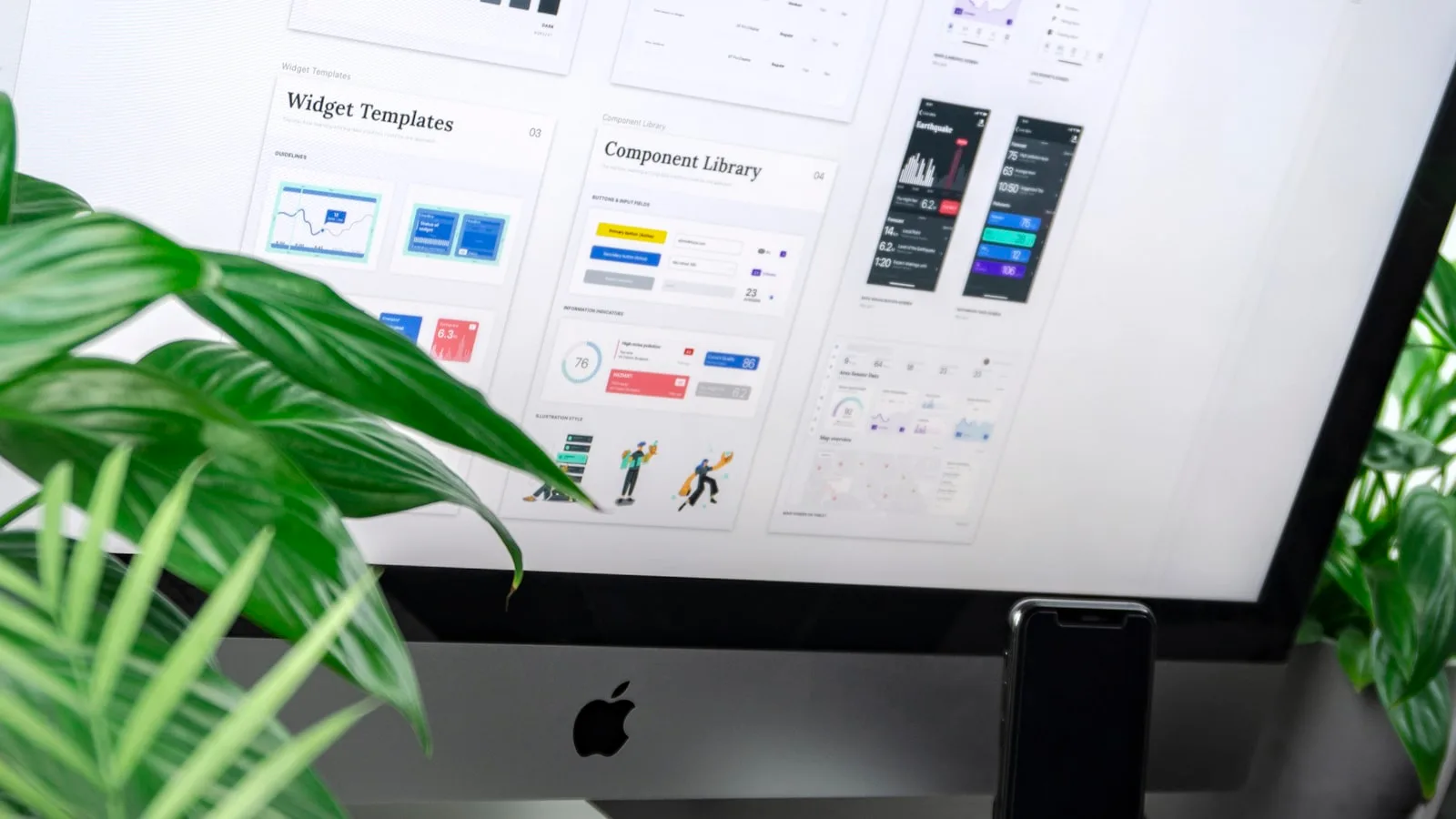 iMac screen showing a UI component library and design system spec