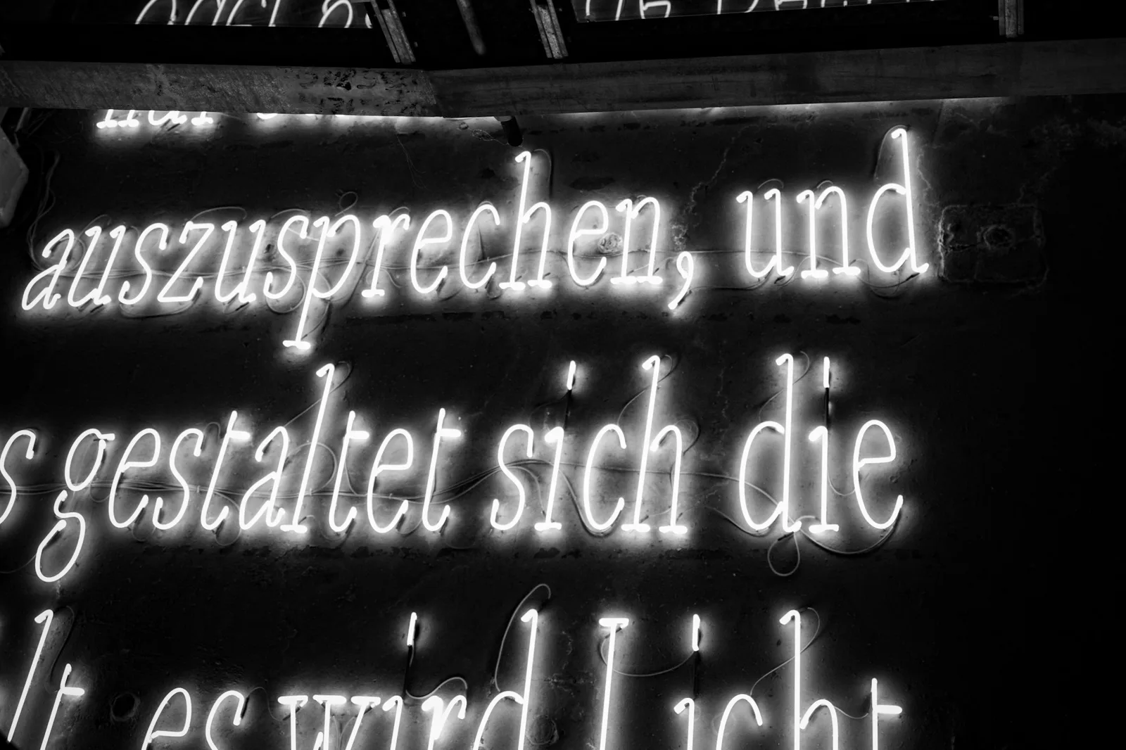 Neon sign text glowing at night, illustrating how kinetic typography uses light and motion to draw attention