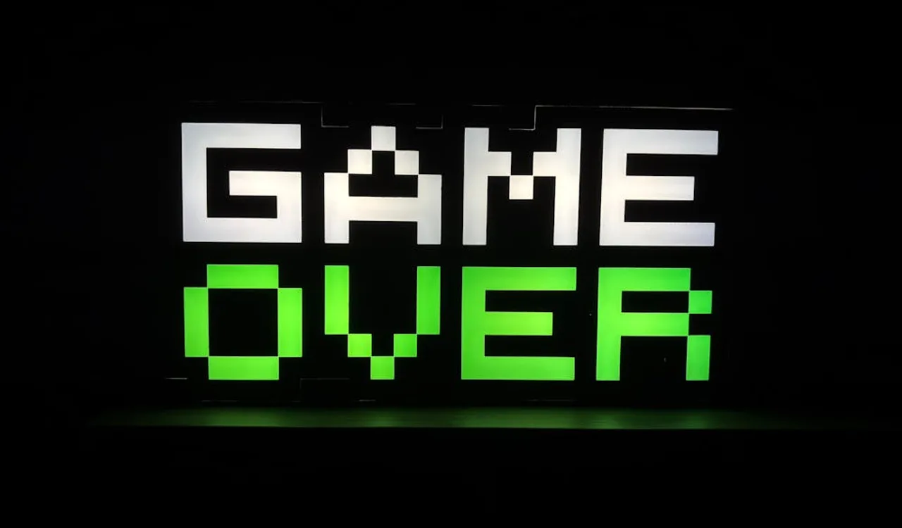 Neon green retro pixel art Game Over screen on dark background illustrating Godot 4 game visual design