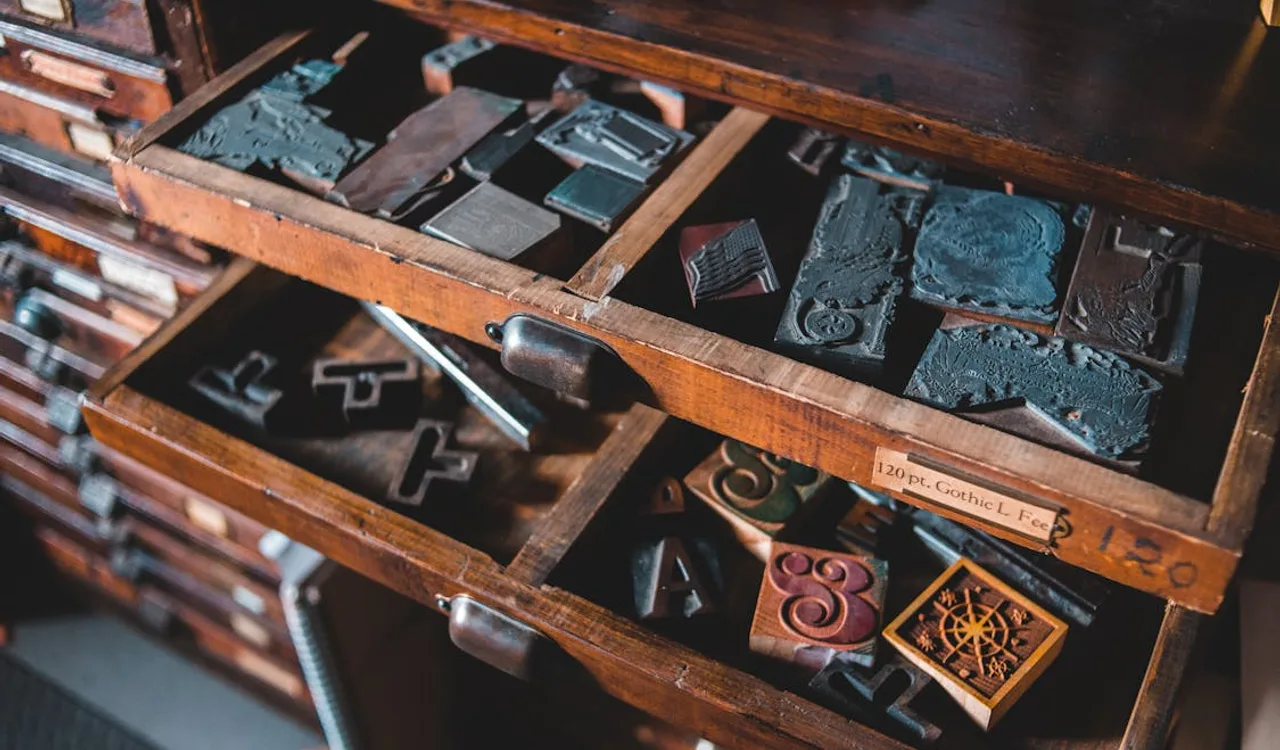 Vintage letterpress type blocks sorted by character illustrating web typography font pairing selection