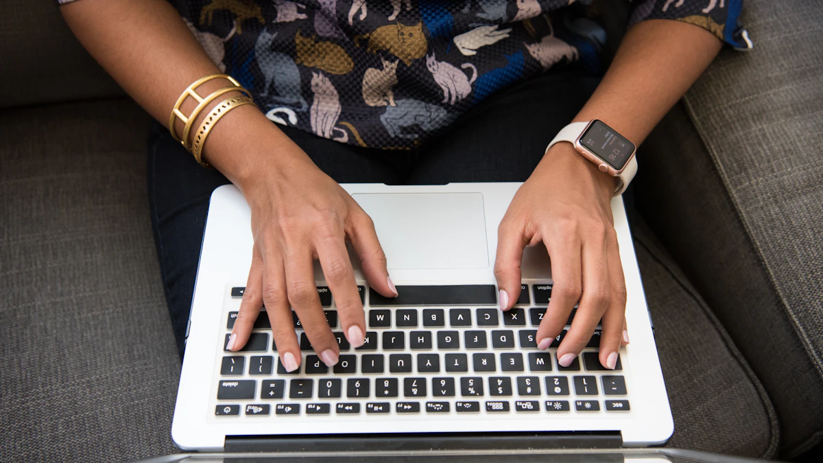A designer and developer reviewing an interface prototype together on a laptop during handoff