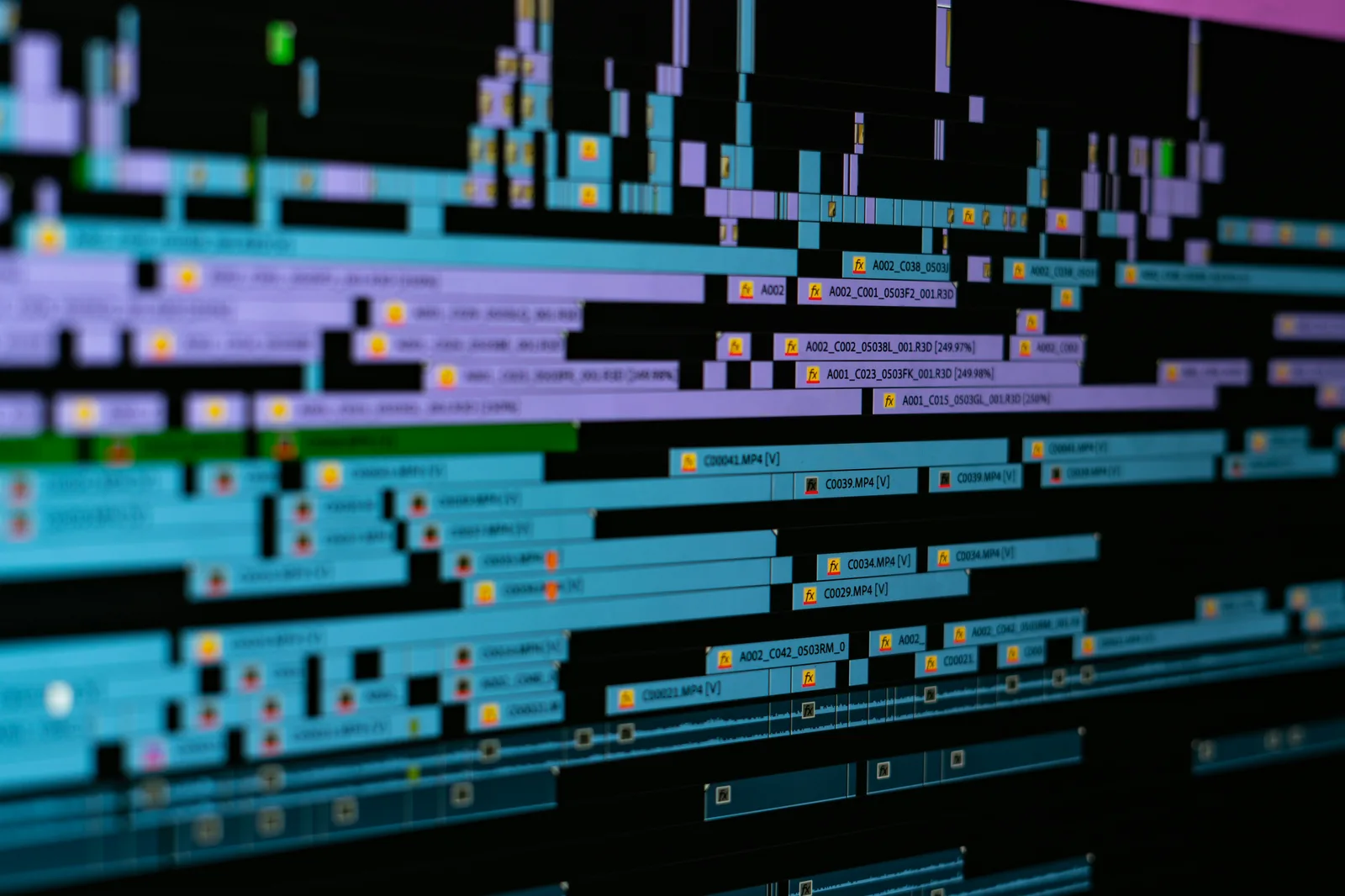 A motion design timeline with layered keyframes below a composition viewport