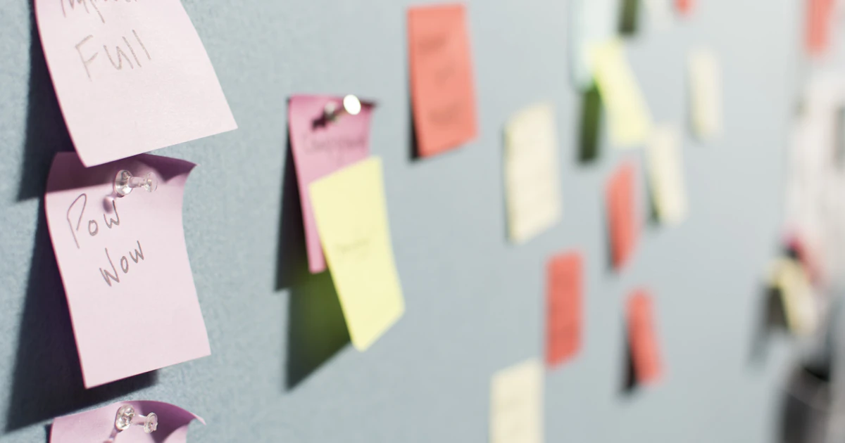 Colorful sticky notes pinned to a planning board