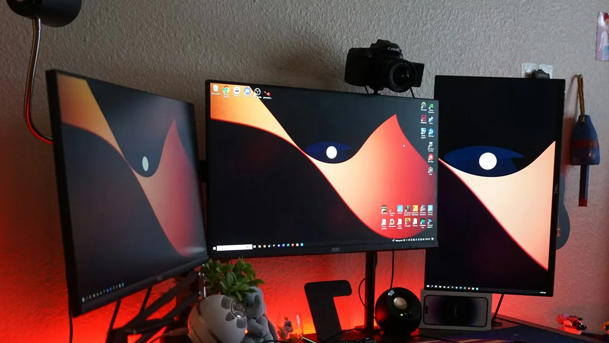 Computer desk with two monitors and a mechanical keyboard set up for focused work