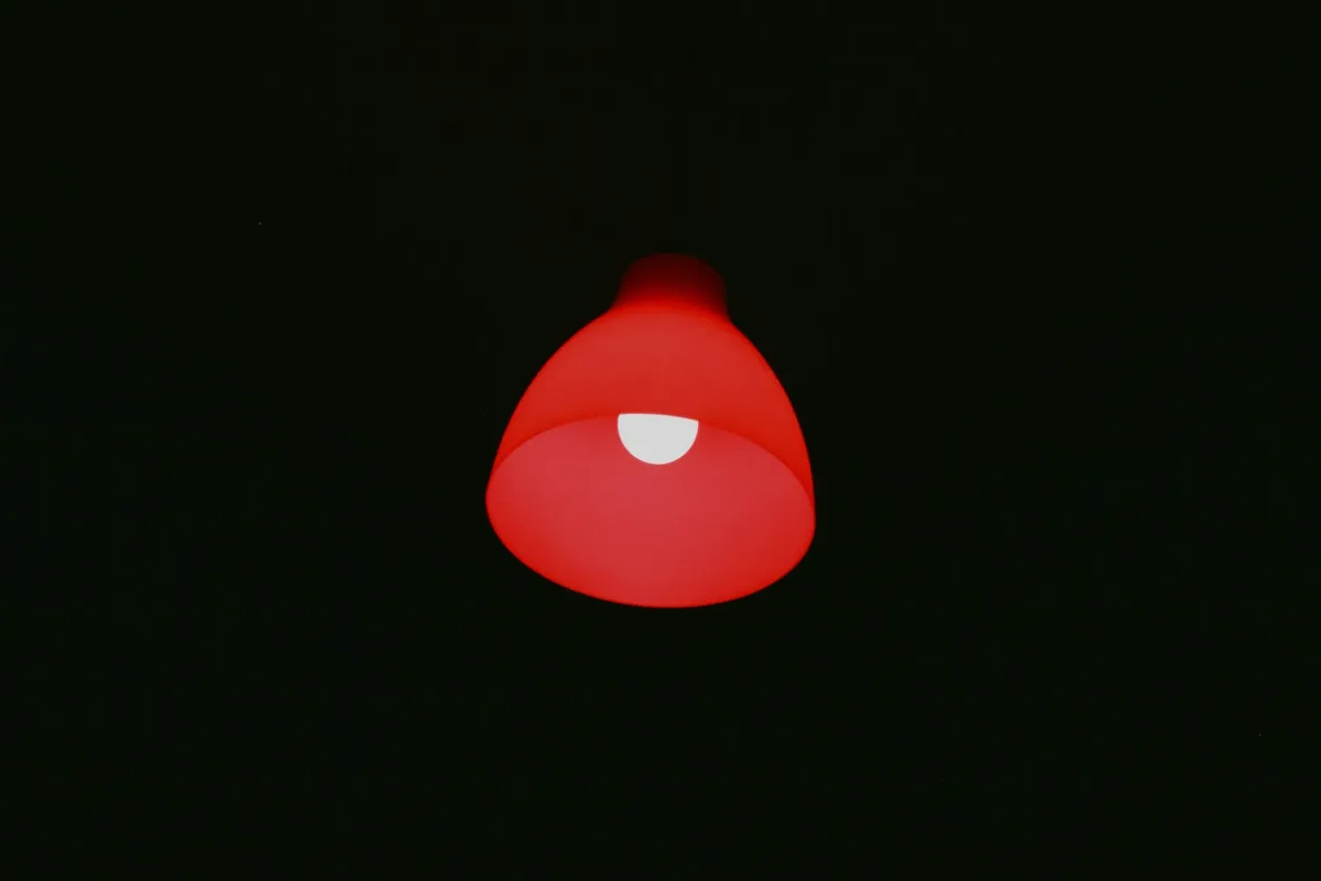 A red ring of light glowing in an otherwise dark room