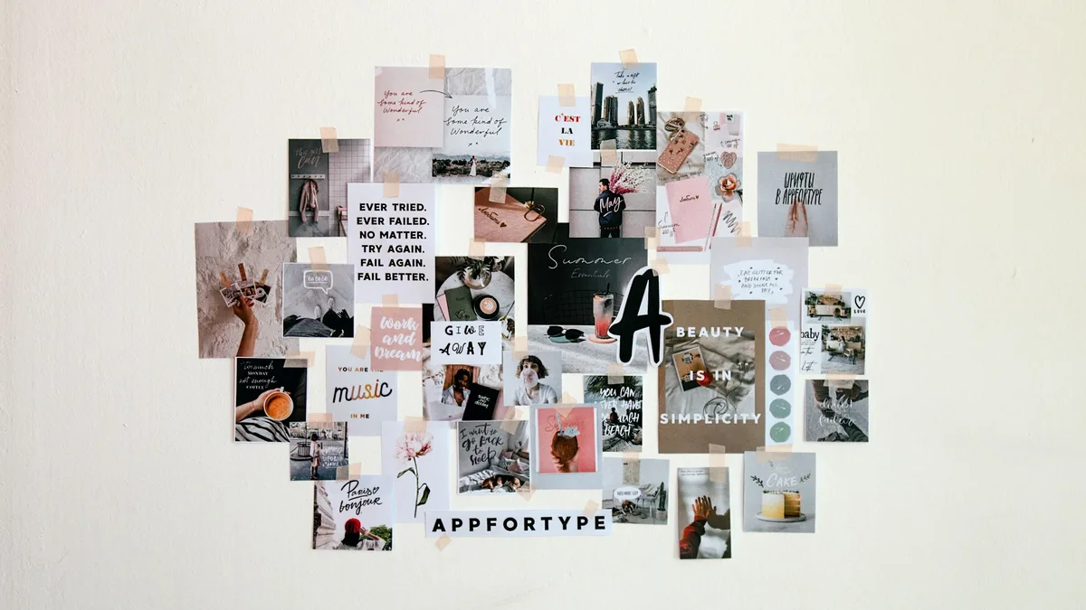 Collage of photographs and text pinned to a white wall in varied sizes