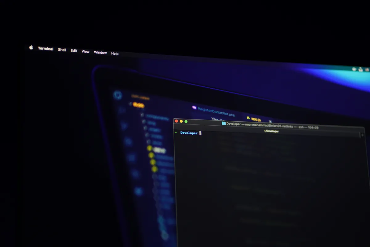 Dark computer monitor screen glowing in a dim room, representing a dashboard viewed in low light