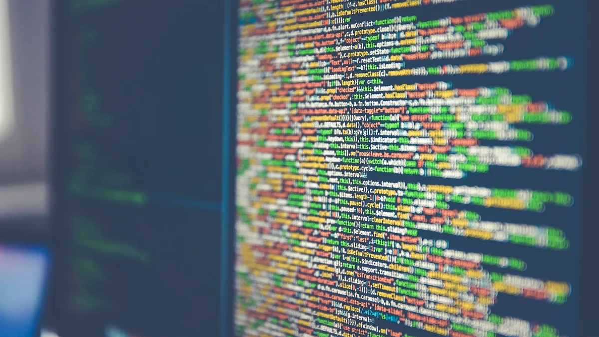 Colorful syntax-highlighted source code on a computer monitor