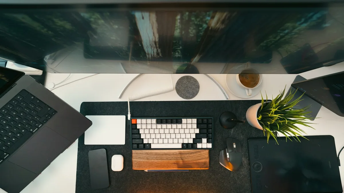Modern desk with a monitor, keyboard and drawing tablet