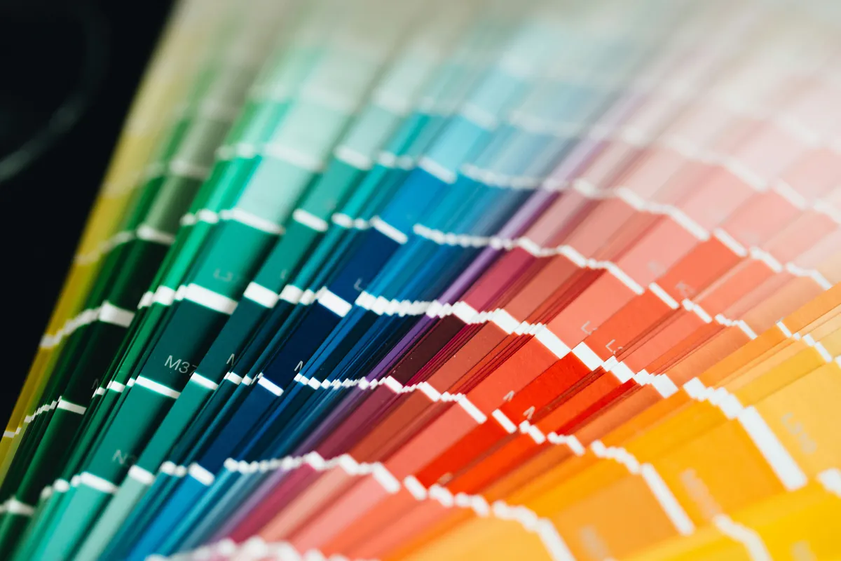 A close-up of color swatch cards stacked into a single block