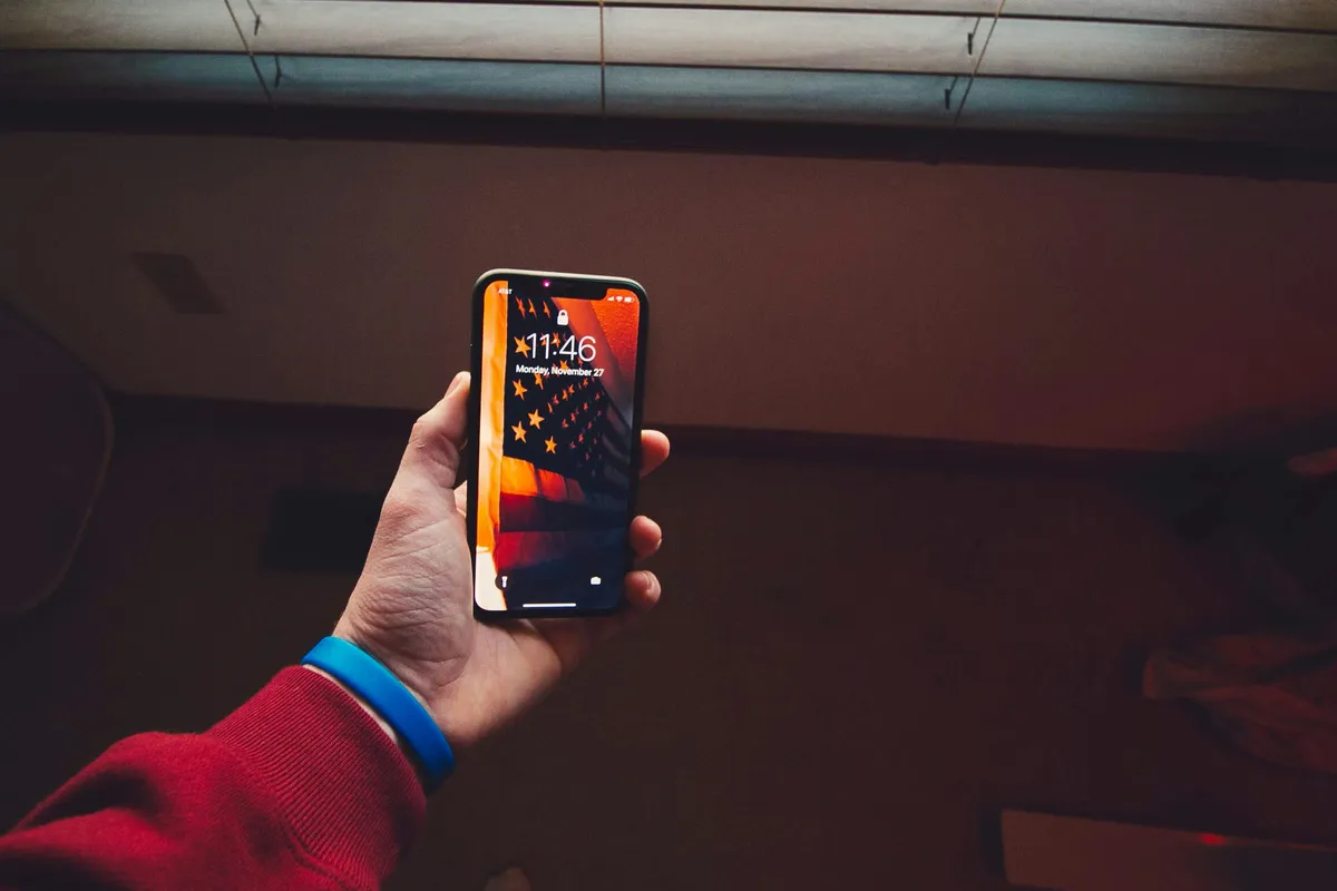 A phone held out at arms length in low light