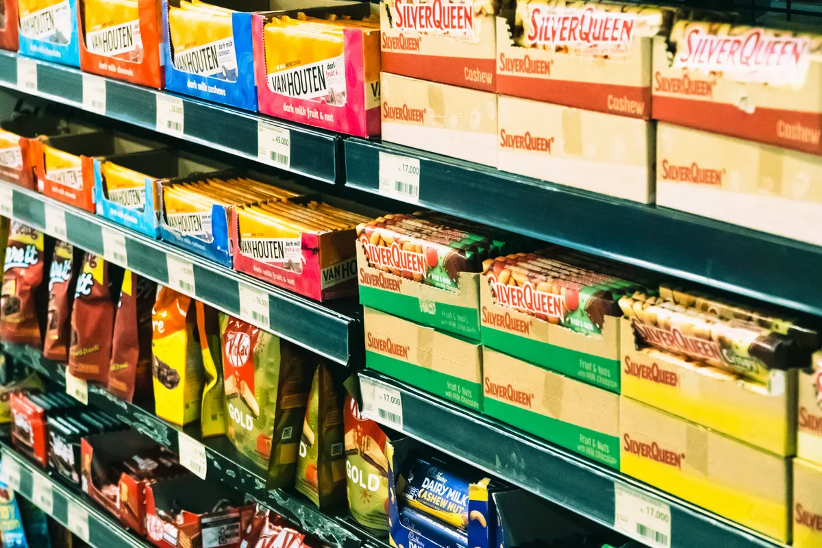 A grocery aisle seen down its whole length