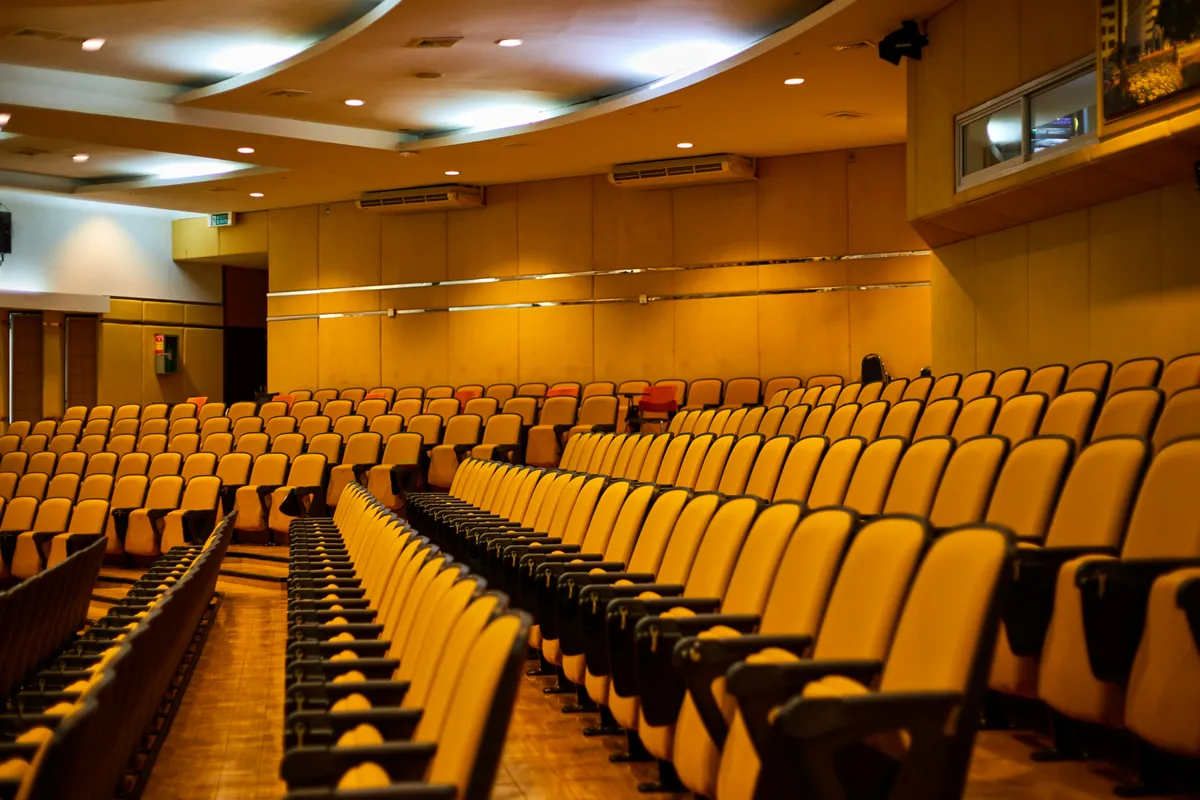An auditorium filled with empty seats before anyone arrives