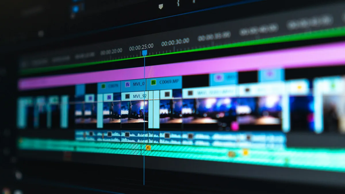 A video editing timeline of blue and purple clips laid out on a dark screen