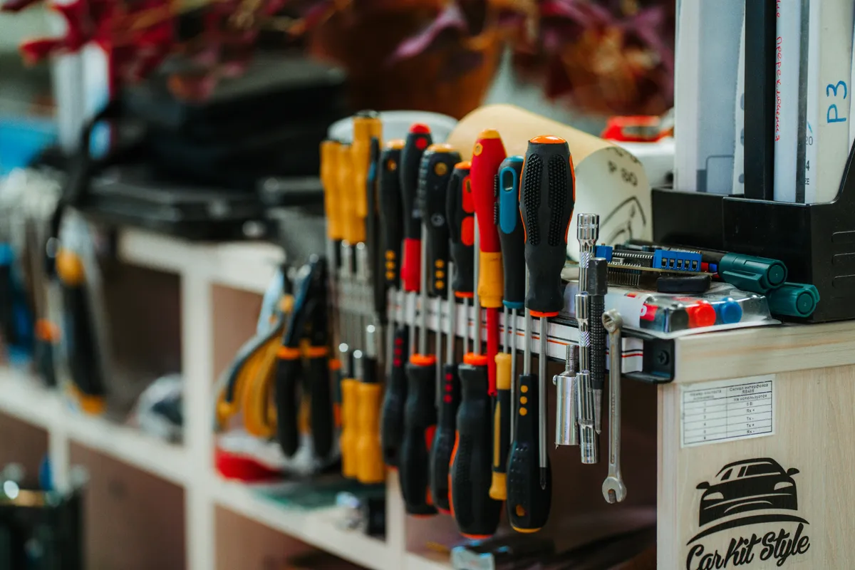 A shelf holding more tools than anyone uses in a day