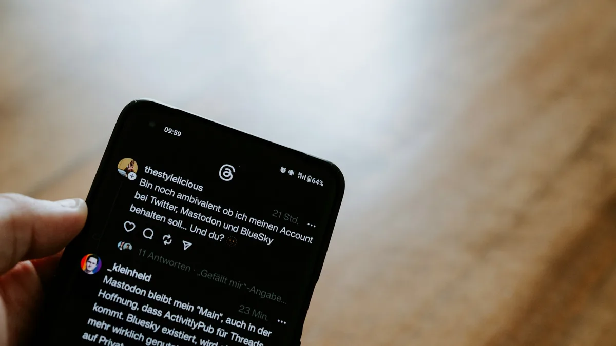 Person holding a smartphone reading a text message on the small screen