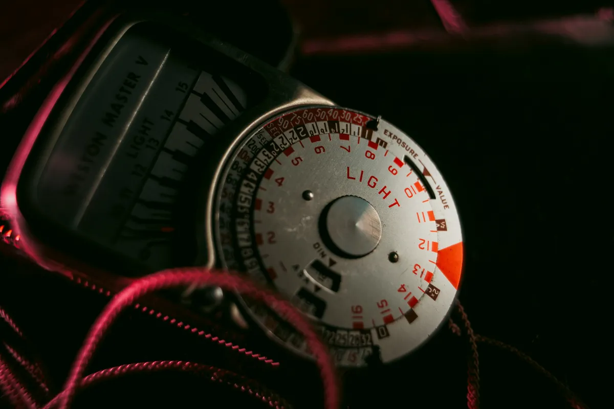 A car speedometer in close crop with the needle sitting low