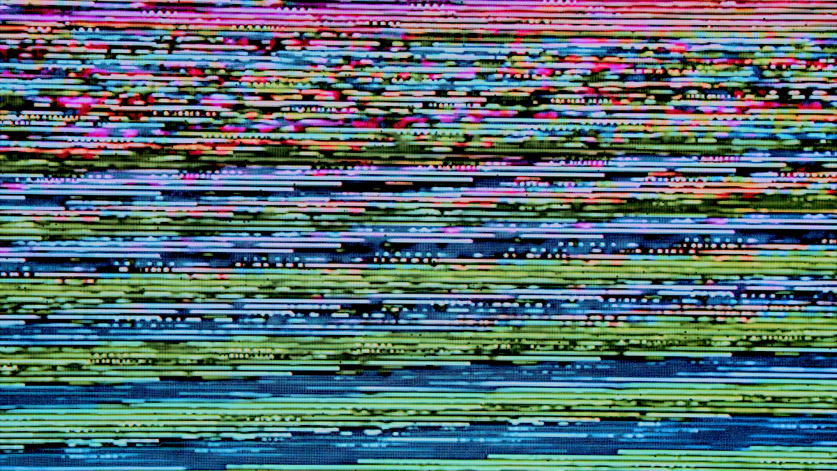 Colorful digital glitch static pattern resembling abstract pixel game art