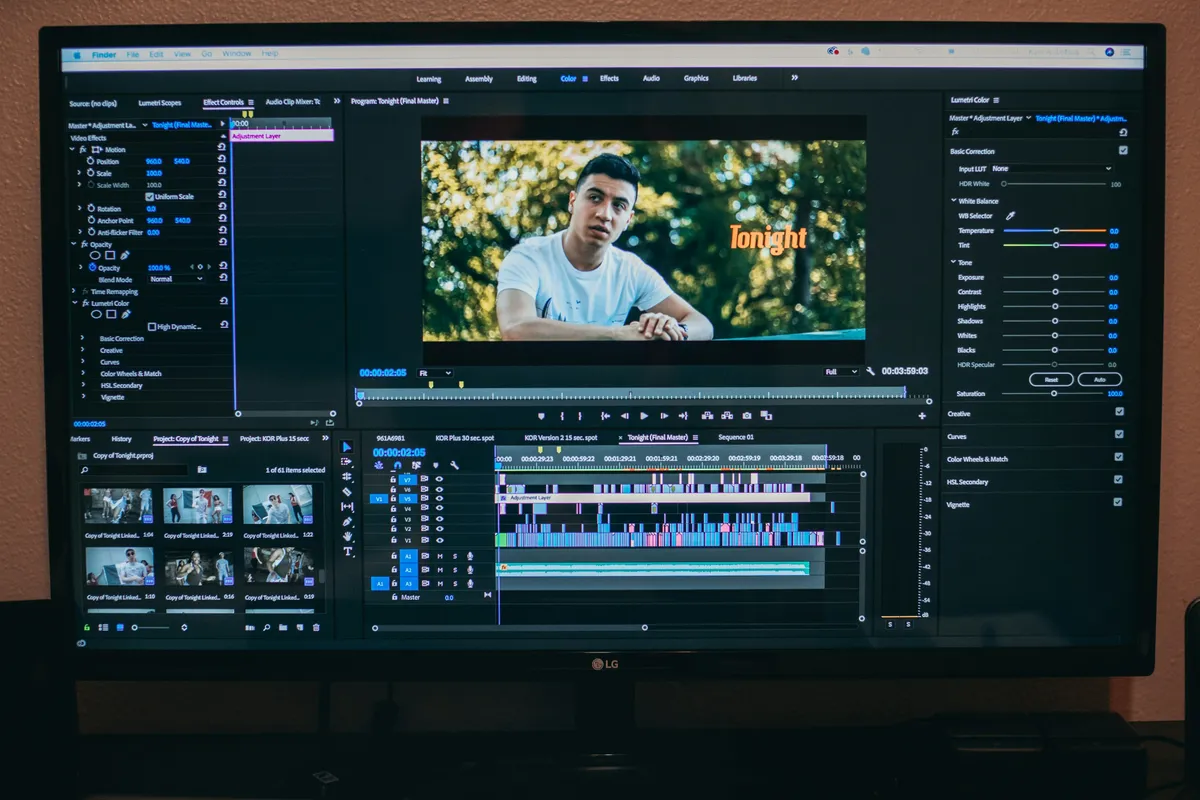 A video editing timeline open across a wide monitor