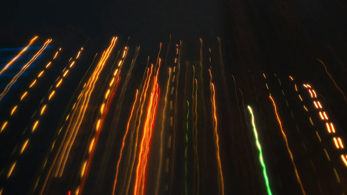 Long exposure photo of colorful light trails suggesting motion and movement over time