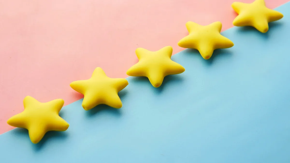Row of yellow star rating icons displayed against a colorful background