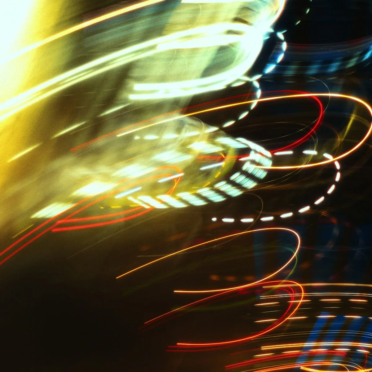 Abstract light streaks in colorful motion blur, representing animated graphics in a product interface