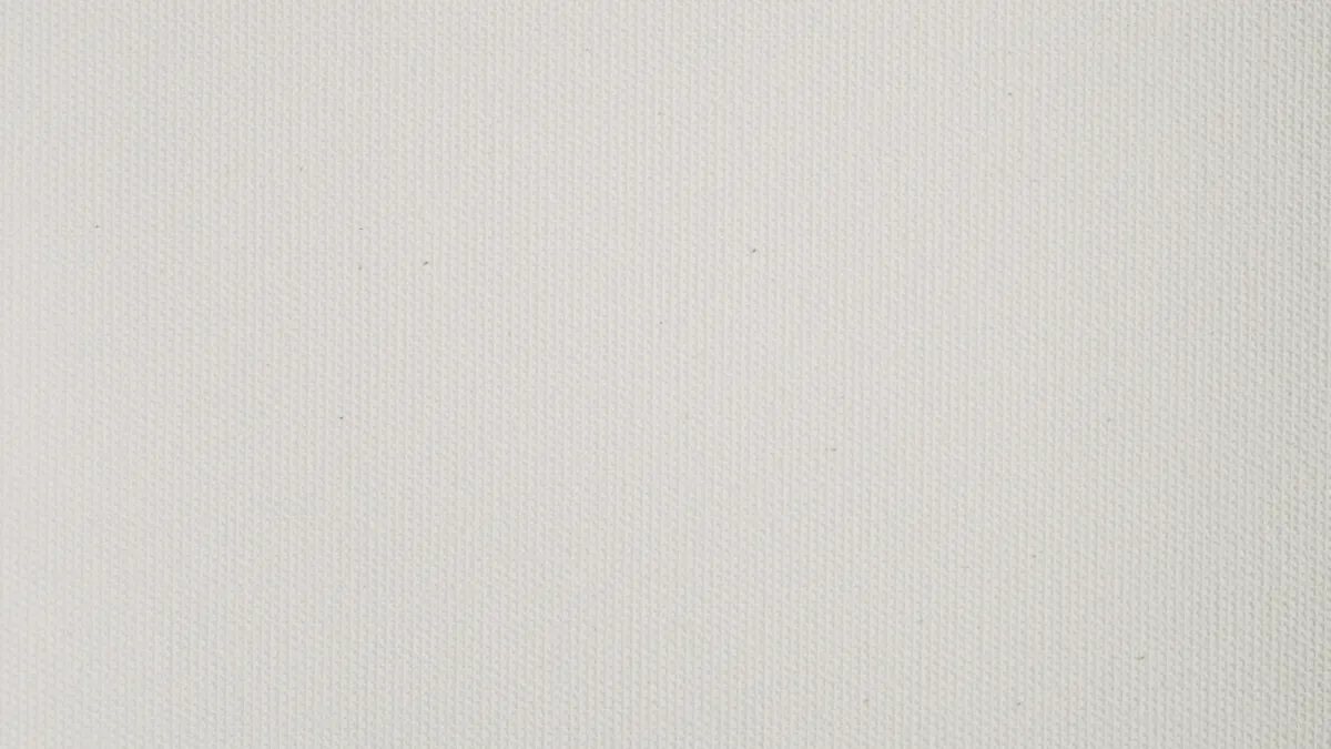Close-up of white canvas showing a fine, even woven texture