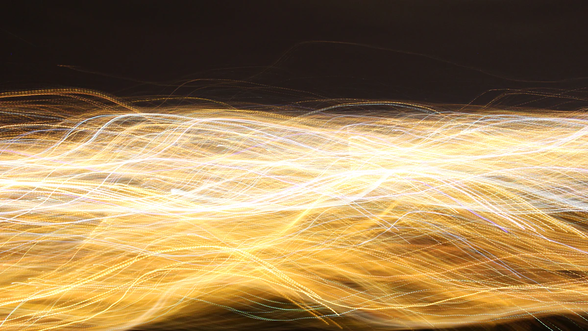 Abstract yellow light streaks from long-exposure motion against dark background