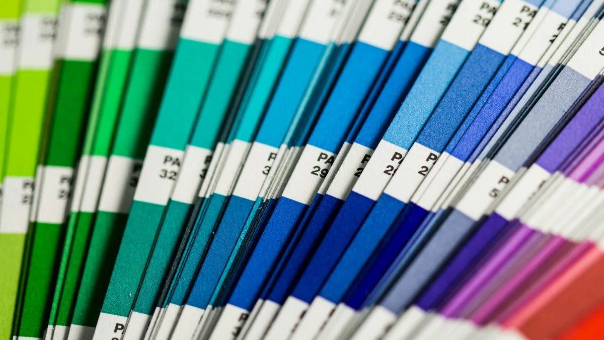 Blue, white, green, and red textile swatches arranged together showing brand color variety