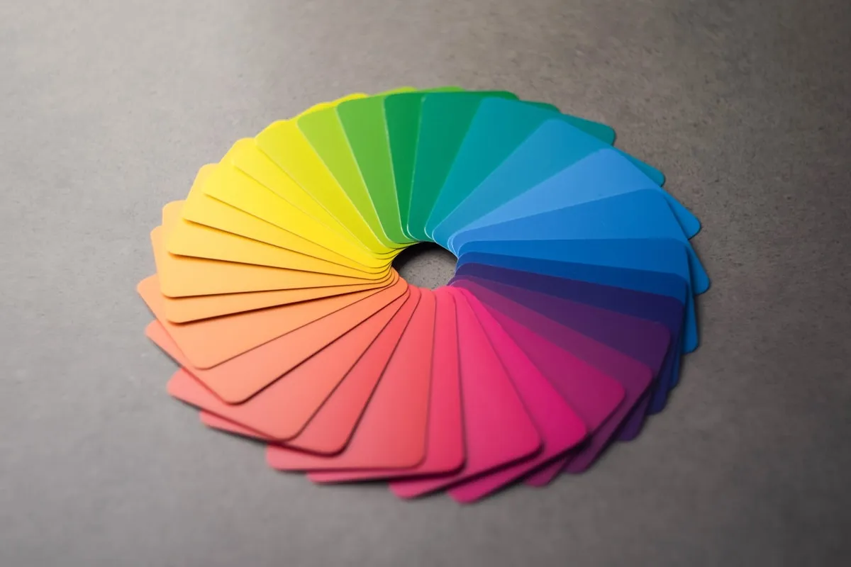 Color swatch cards laid out in a circular wheel showing hue relationships