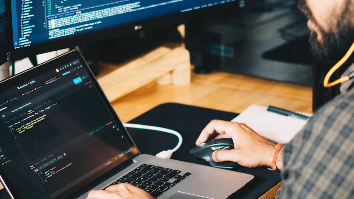 A designer working on UI layouts at a laptop in a modern studio