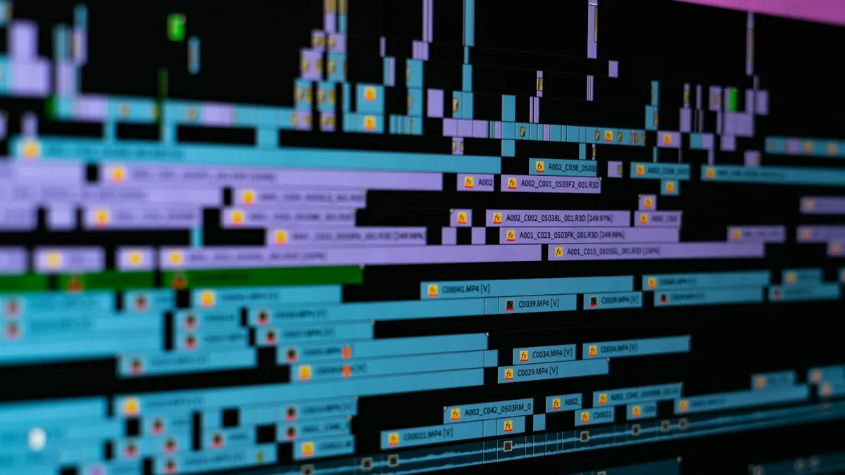 Design software interface windows layered across a computer monitor in a workspace