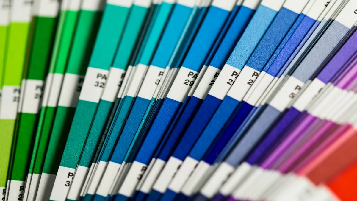 Blue, white, green and red fabric swatches overlapping on a flat surface