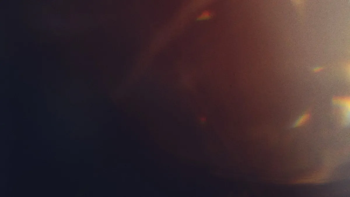 Bright light flares and bokeh against a dark background showing contrast and focal emphasis