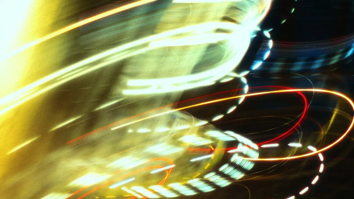 Colorful light streaks blurred in motion showing energy and directional movement