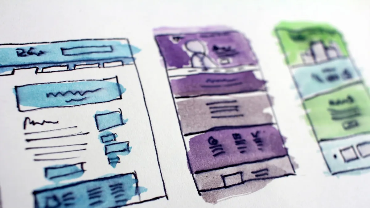 Hand-drawn website wireframe sketches showing layout structure and content blocks